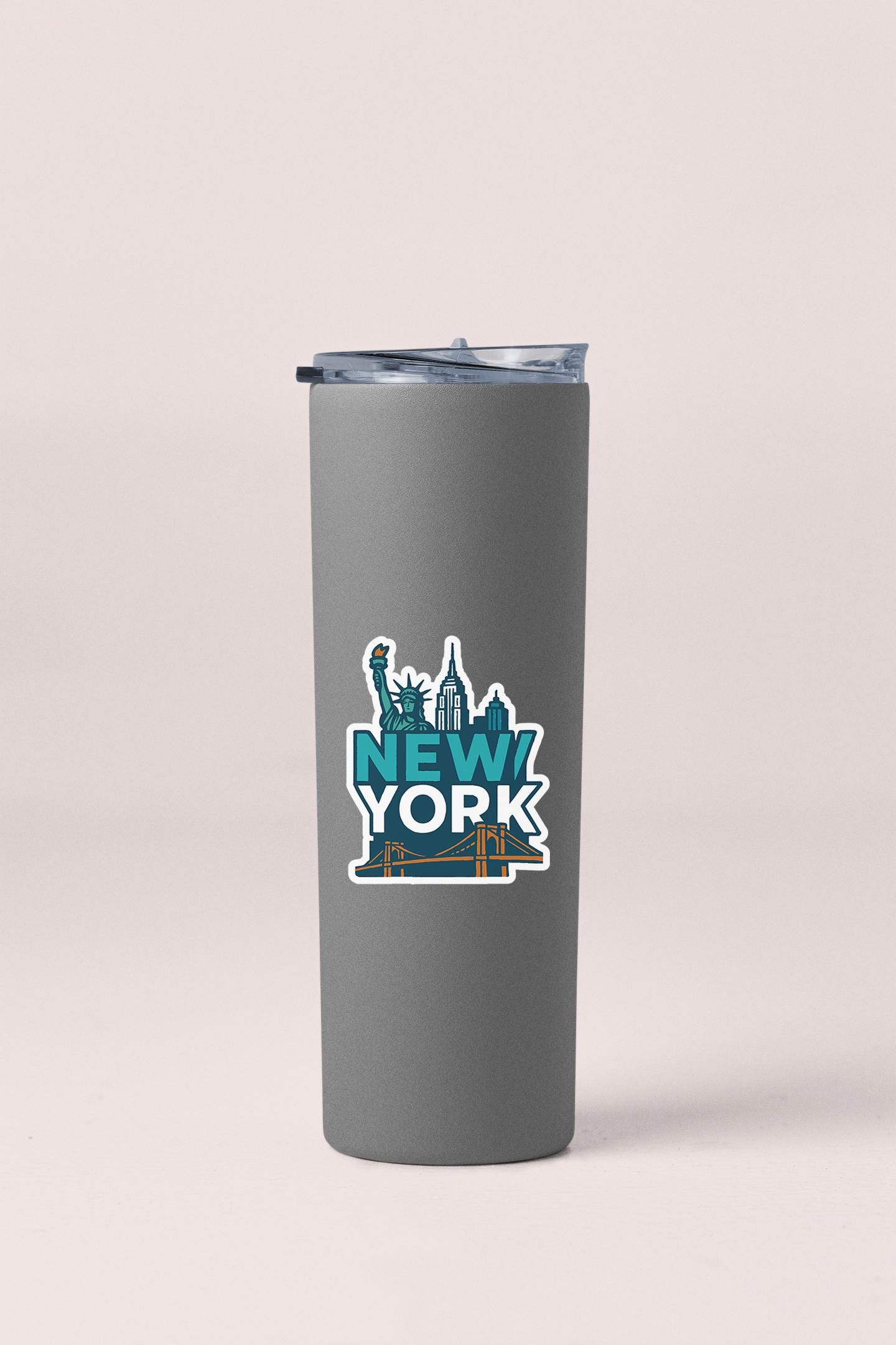 a travel mug with a new york sticker on it