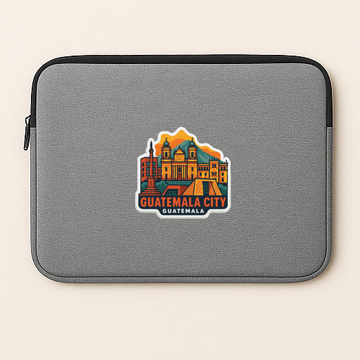A gray laptop sleeve with a sticker depicting the city of Guatemala City.