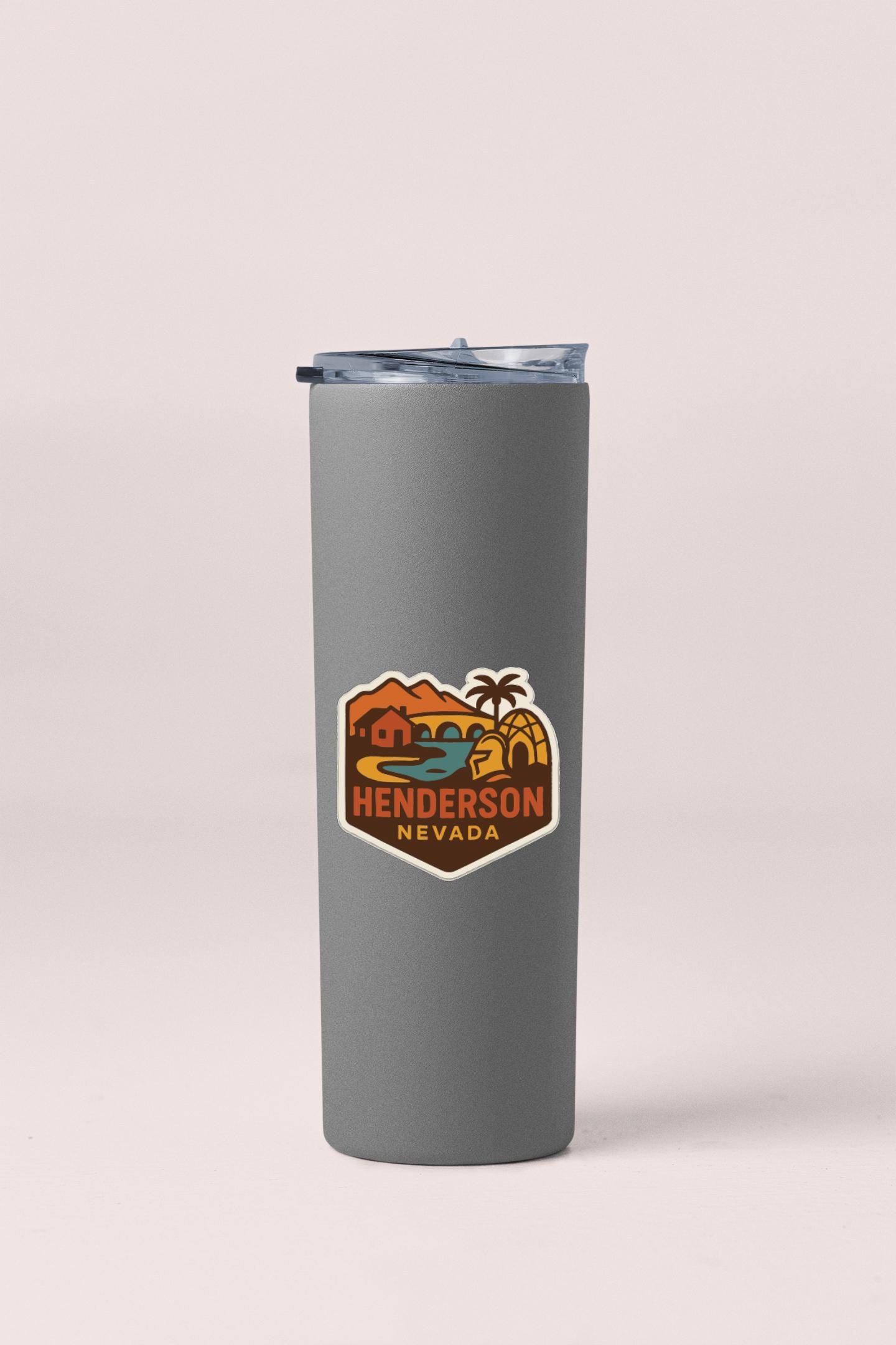 A gray insulated tumbler with a logo that says "Henderson Nevada" on it.