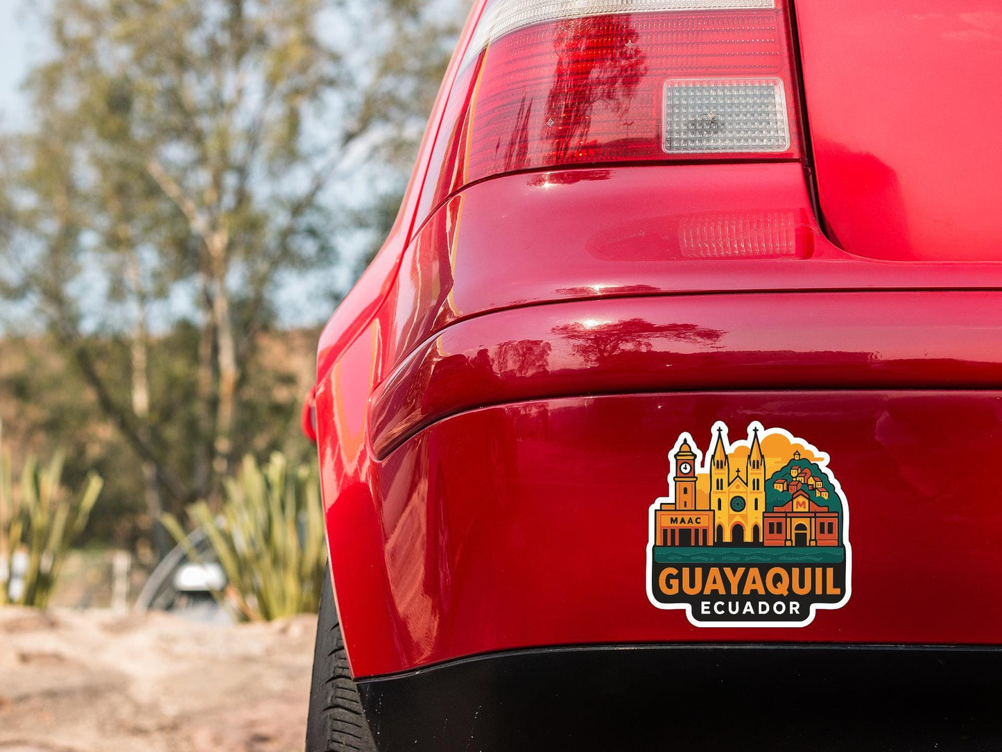 the rear end of a red car with a sticker on the trunk that displays the city of Guayaquil, Ecuador.