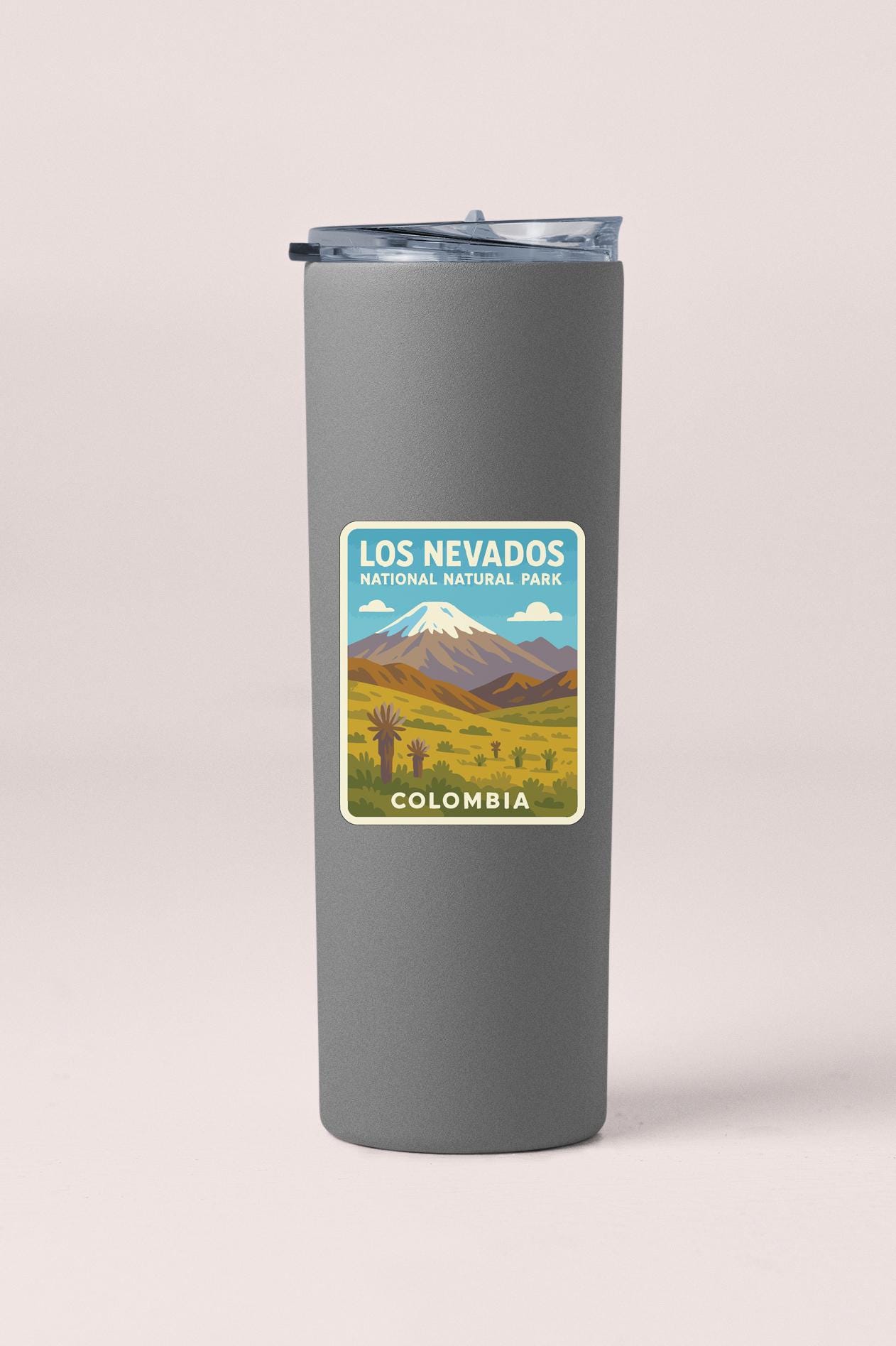A gray insulated tumbler with a label that says "LOS NEVADOS NATIONAL NATURAL PARK COLOMBIA".
