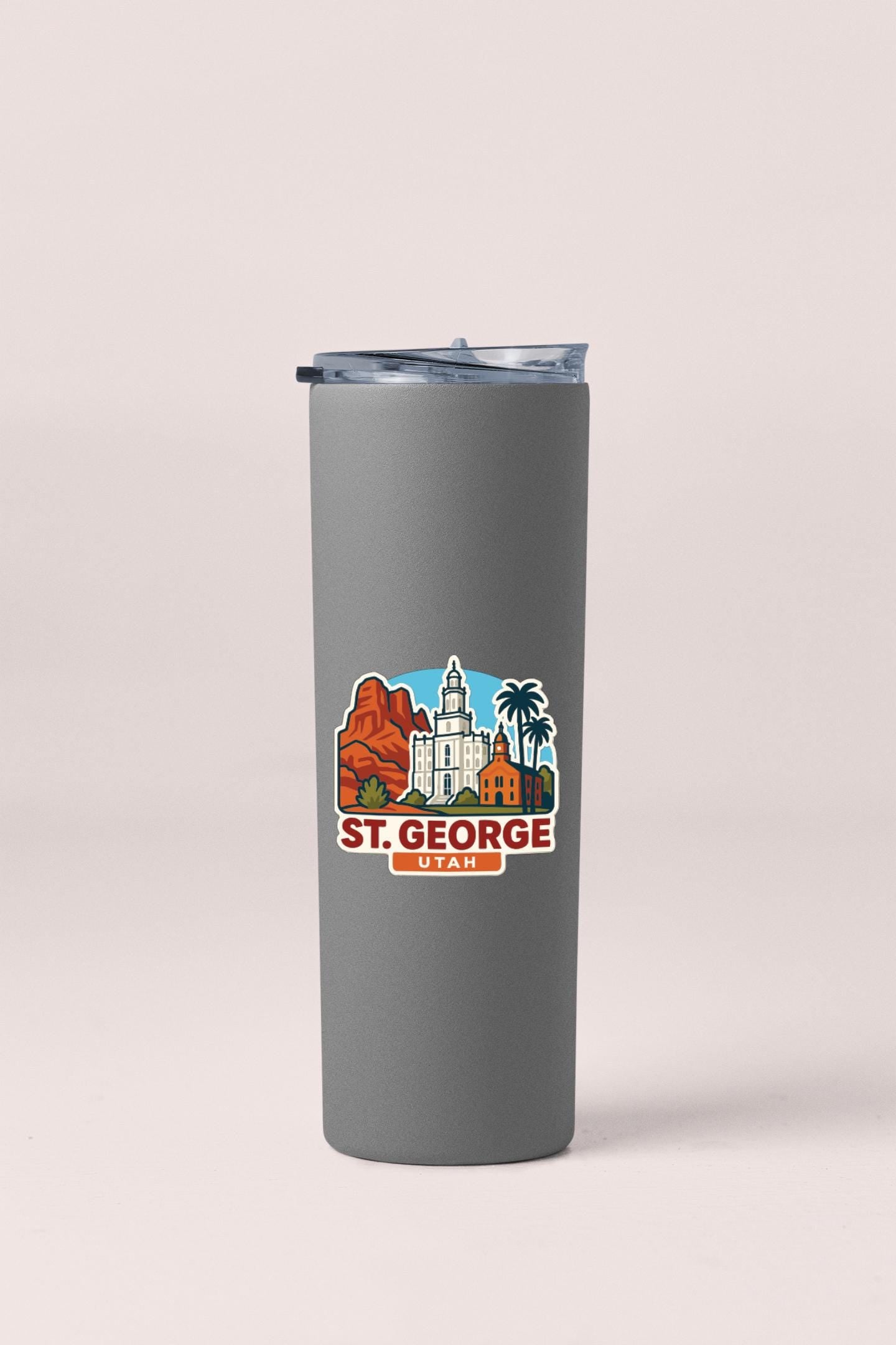 A gray insulated tumbler with a printed St. George, Utah logo on it.