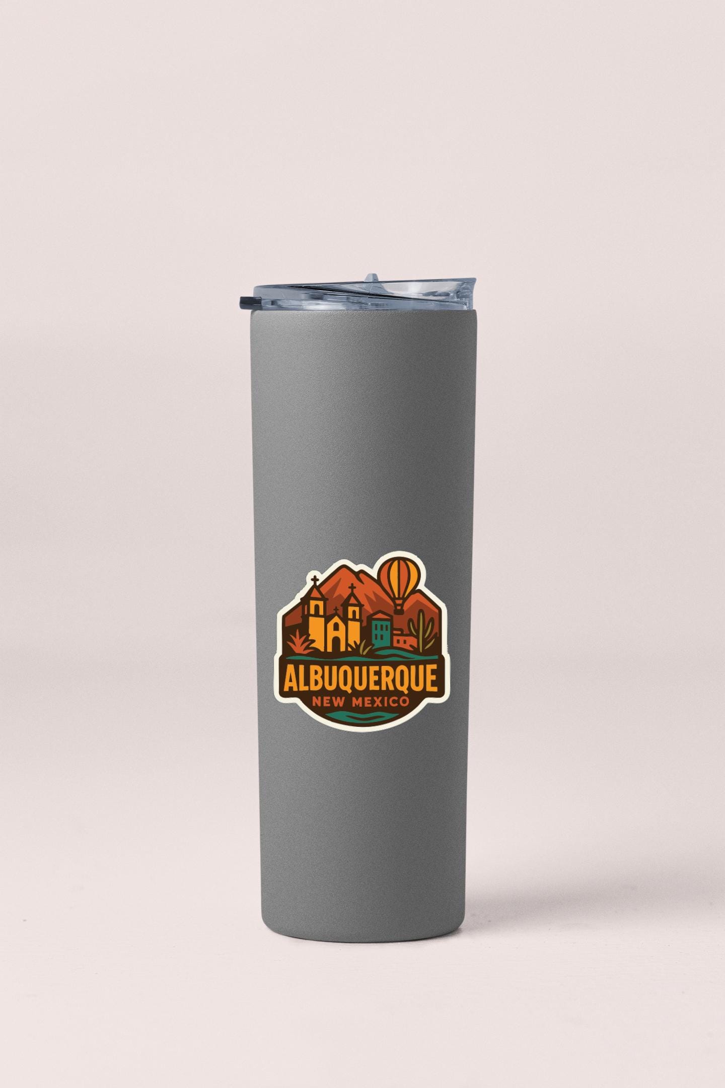 A gray insulated tumbler with a printed label that says "ALBUQUERQUE NEW MEXICO".