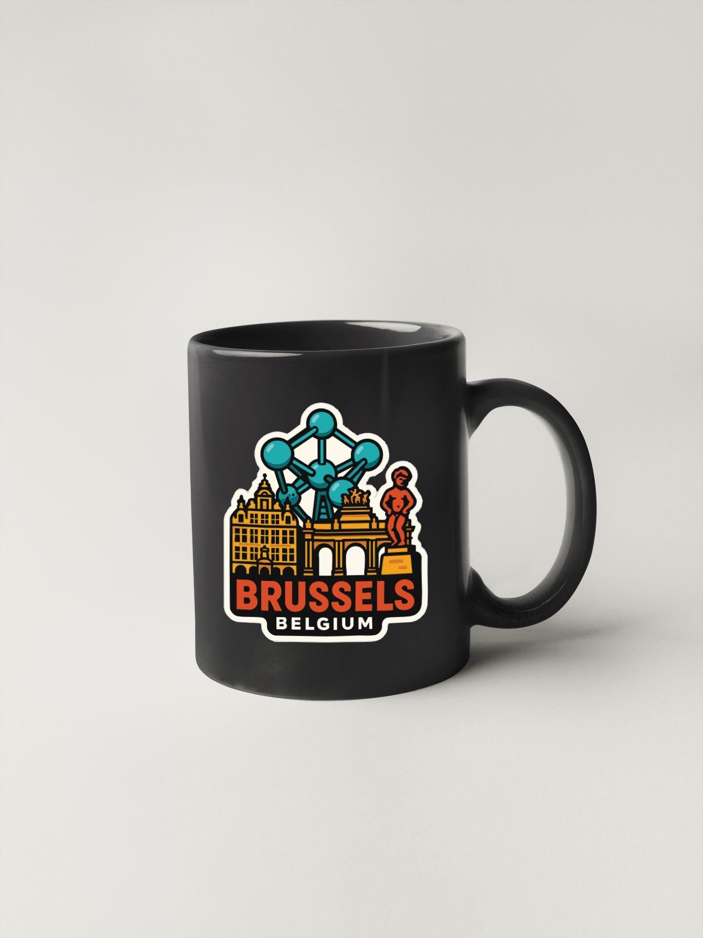 A black coffee mug with a graphic design depicting the city of Brussels, Belgium.