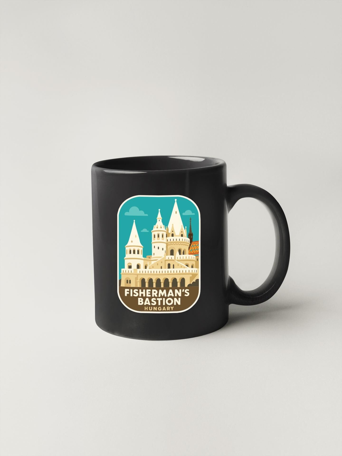 A black coffee mug with a graphic design depicting a castle or palace-like structure.