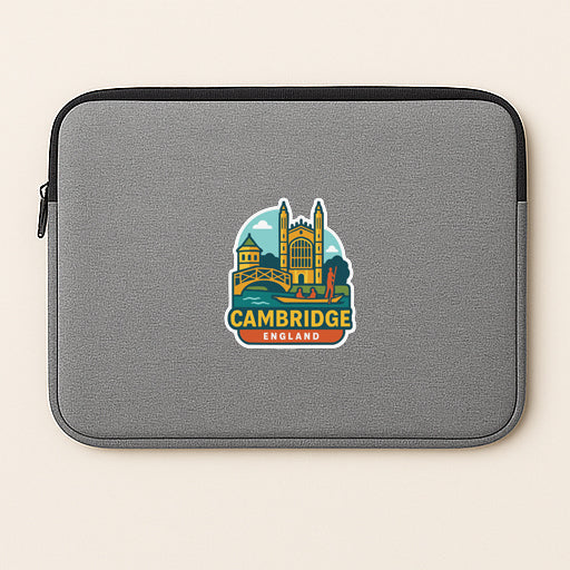 A gray laptop sleeve with a colorful sticker of the city of Cambridge, England, featuring a castle and a bridge.