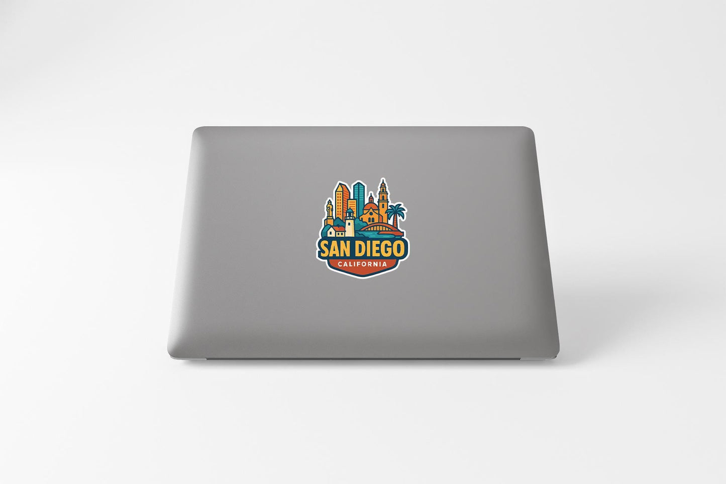 a laptop computer with a san diego sticker on it