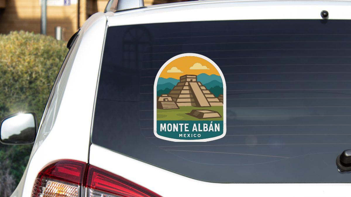 a sticker on the rear window of a car that displays the name "Monte Alban" and the location "MEXICO".