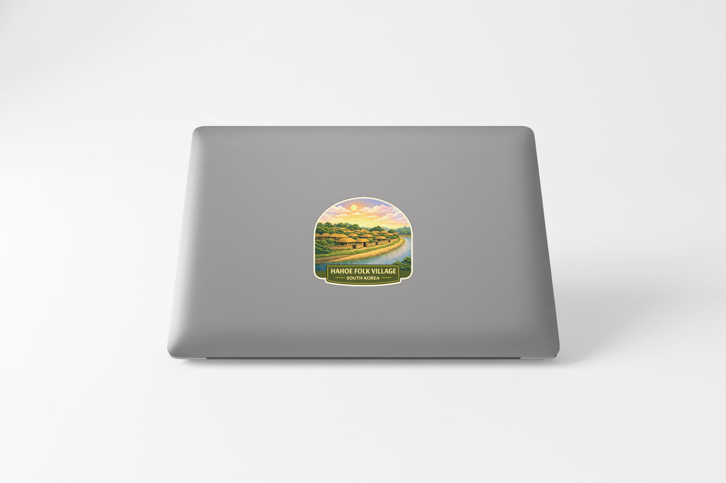 a sticker with a scenic landscape on a laptop.