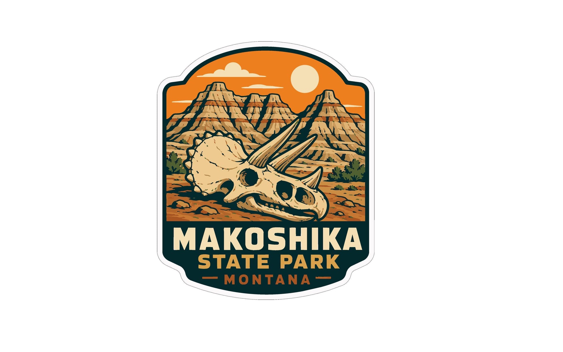 a sticker or emblem with a stylized illustration of a dinosaur skull and mountains in the background. The text "Makoshika State Park Montana" is prominently displayed, indicating the location or theme of the image.