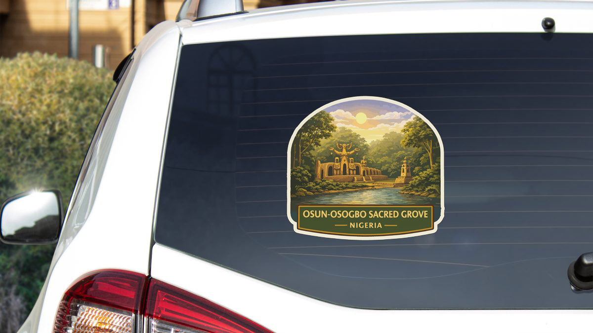 a sticker on the rear window of a white car, depicting a scenic landscape with a temple in the background.