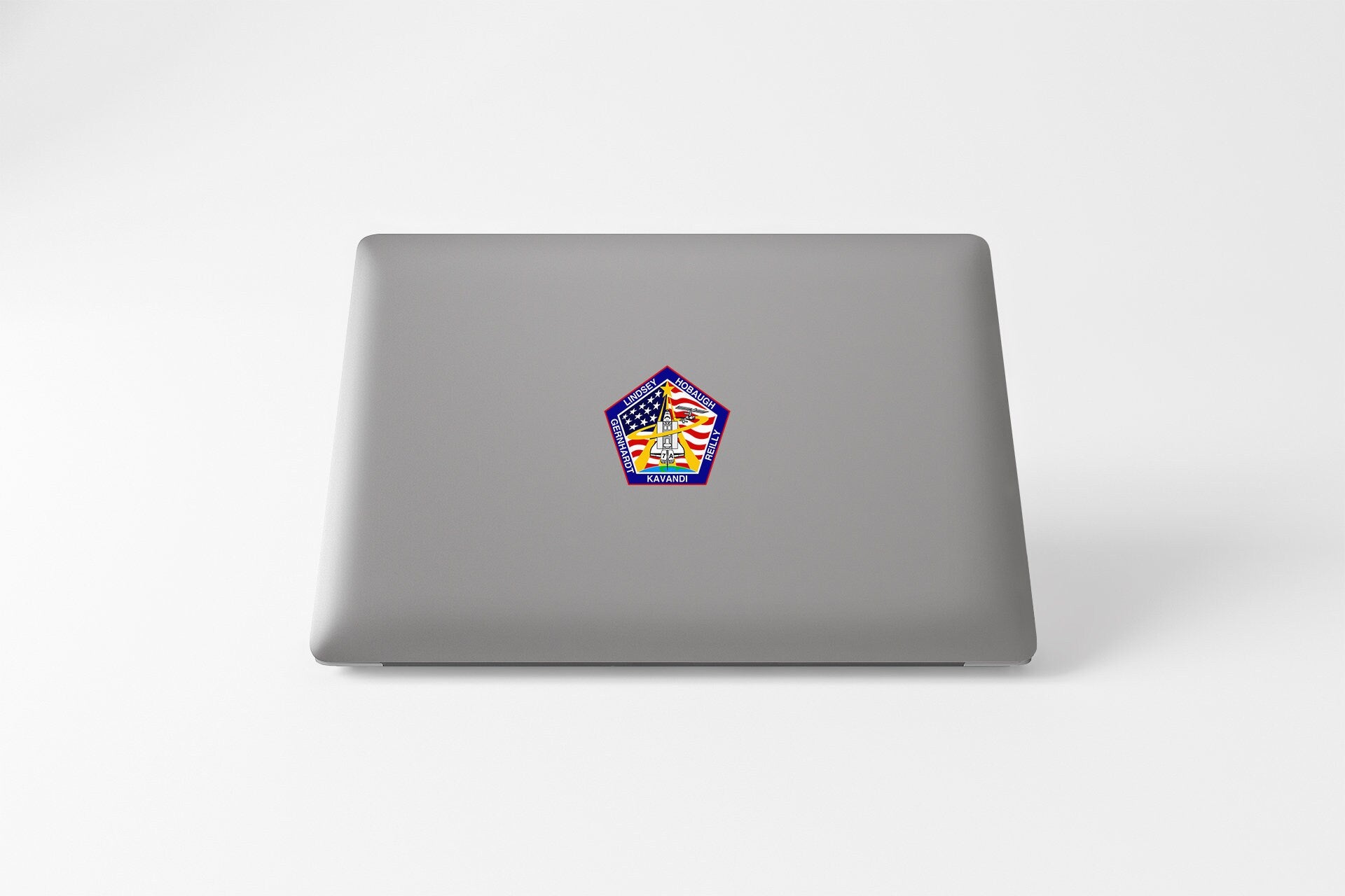 a laptop with a sticker of a house
