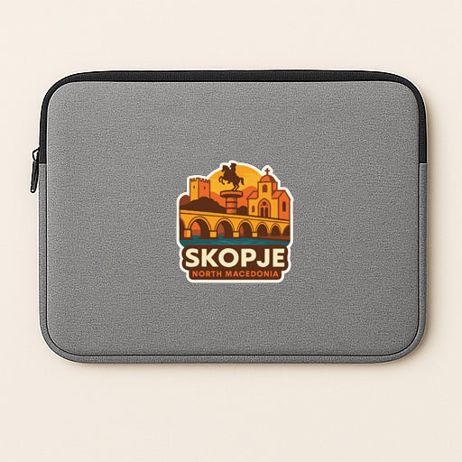 A gray laptop sleeve with a sticker depicting a cityscape and the text "SKOPJE NORTH MALCONI".
