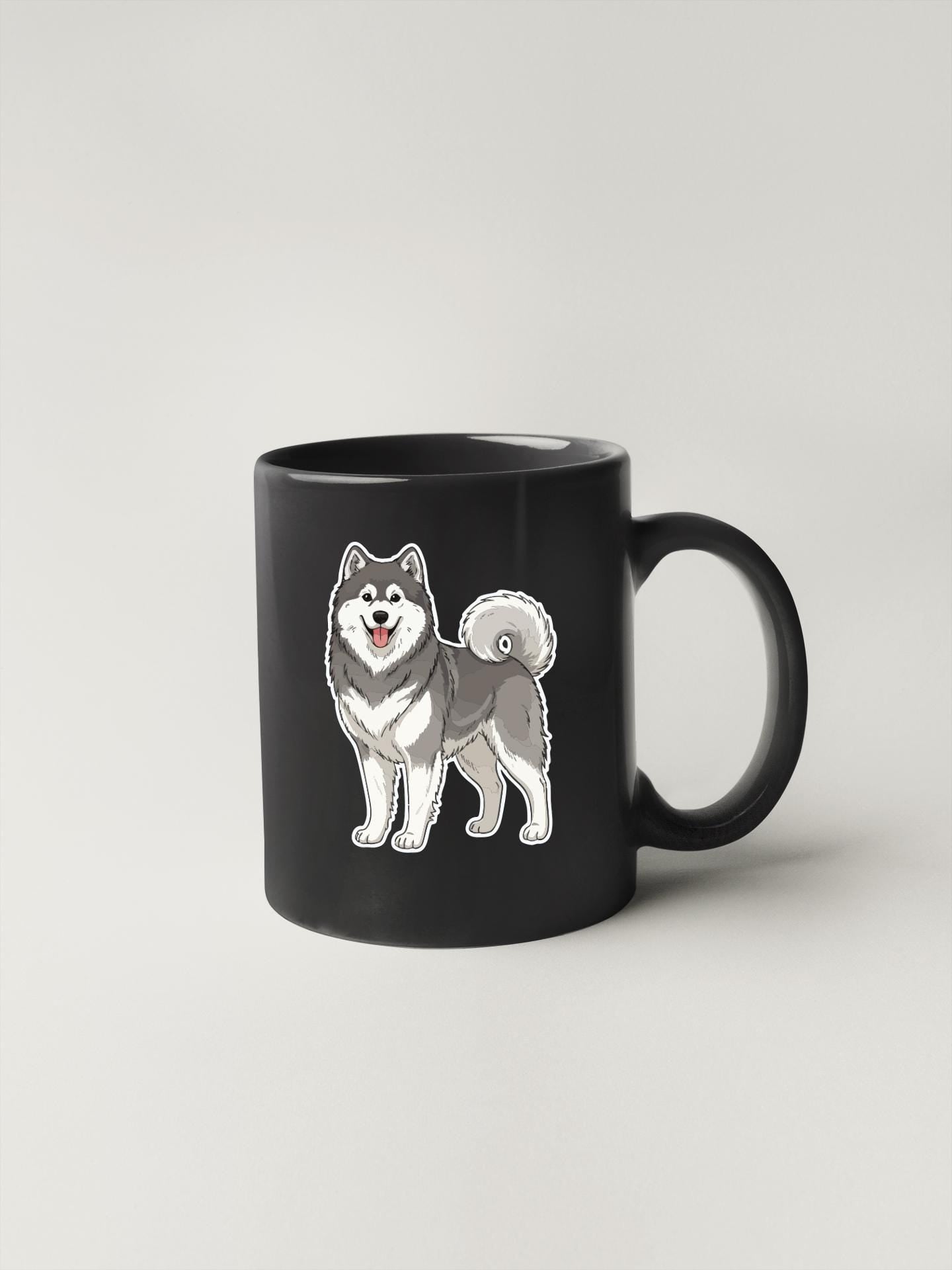 A black coffee mug with a cartoon illustration of a husky dog on it.