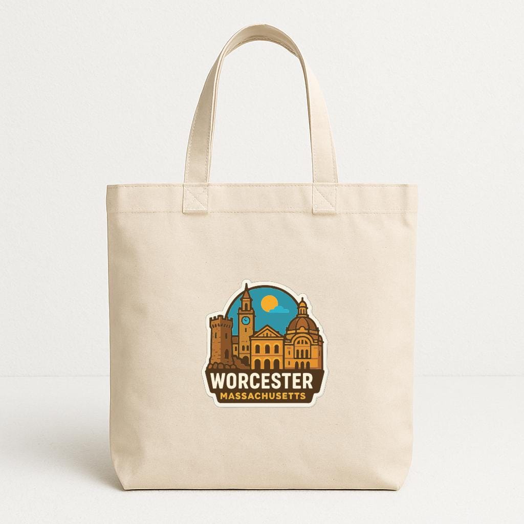 A beige tote bag with a graphic design featuring a city skyline and the text "Worcester Massachusetts" printed on it.