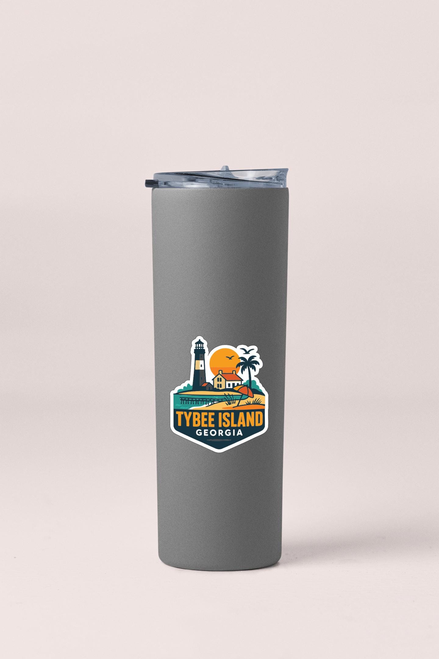 A gray insulated tumbler with a printed label that says "TYBEE ISLAND GEORGIA".