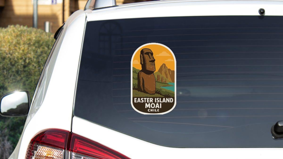 a sticker on the rear window of a car, depicting Easter Island and Moai, with the text "EASTER ISLAND MOAI CHILE" printed on it.