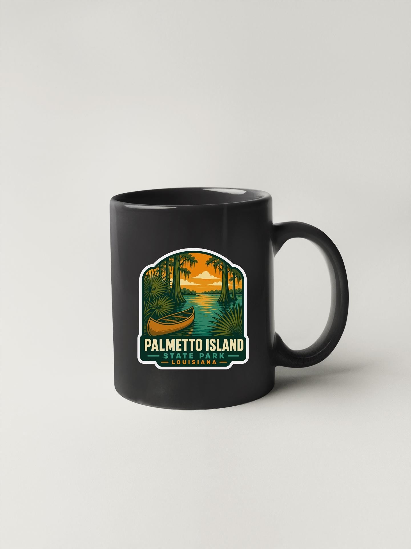 A black coffee mug with a graphic design depicting palm trees, a boat, and a sunset over a body of water, representing the location of Palmetto Island, Louisiana.