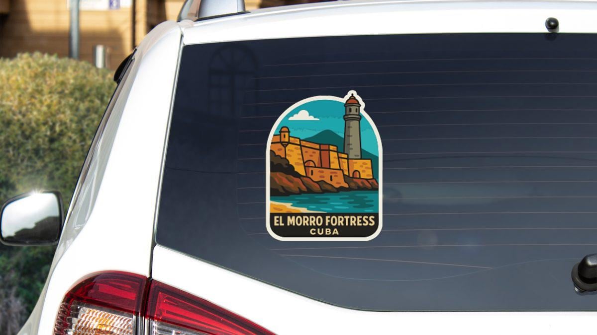 A sticker on the rear window of a car, depicting the El Morro Fortress in Cuba.