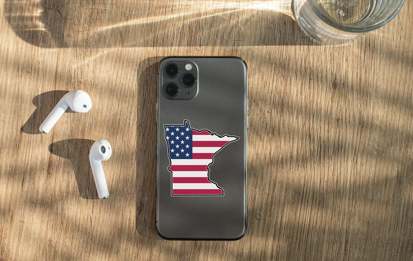 a cell phone with a sticker of the state of minnesota