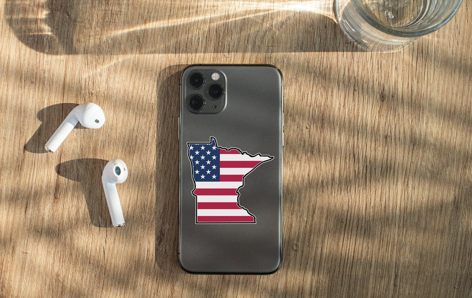 a cell phone with a sticker of the state of minnesota