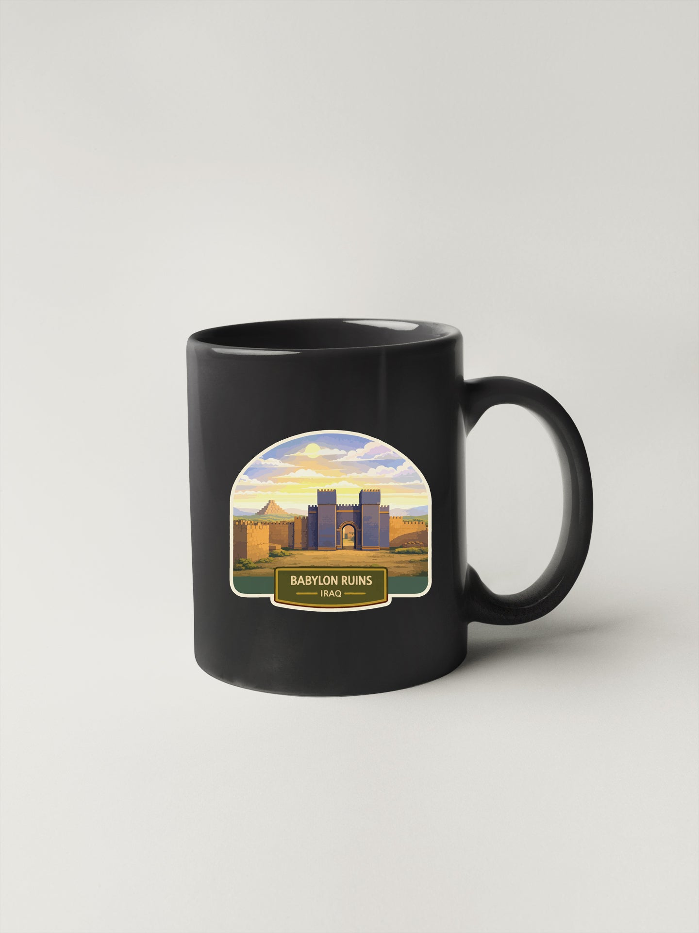 A black coffee mug with a graphic design depicting the ruins of Babylon, specifically the city of Babylon, Iraq.