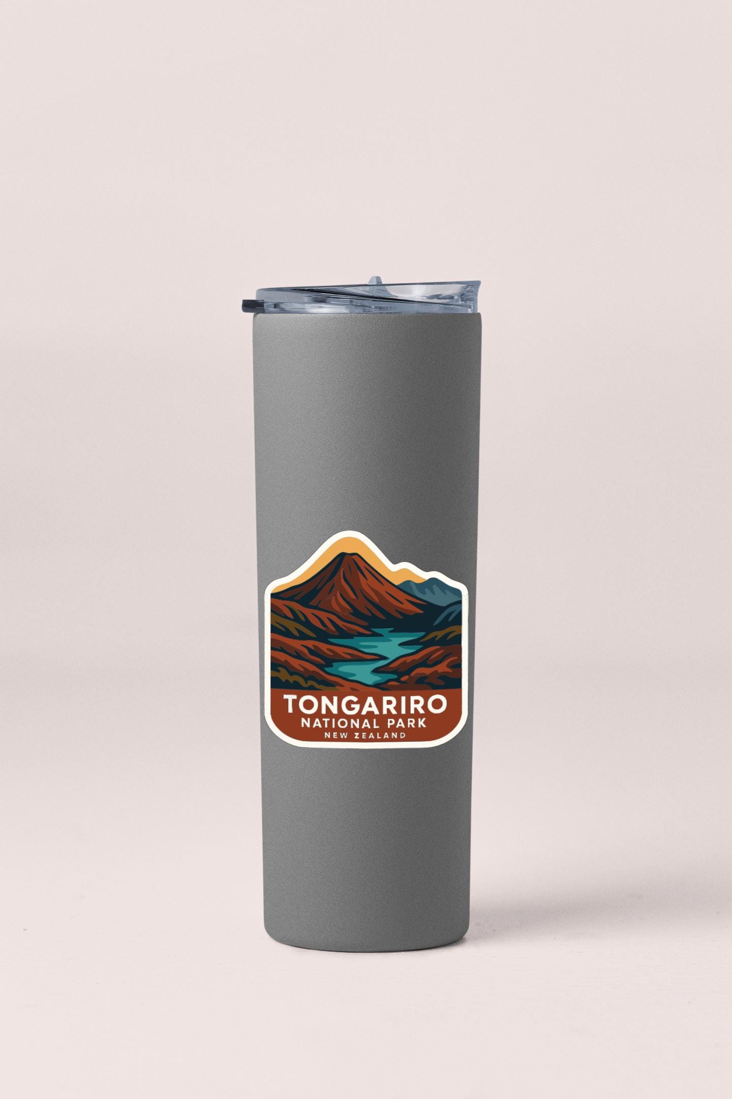 A gray insulated tumbler with a label that says "Tonga Park Tongararo New Zealand".