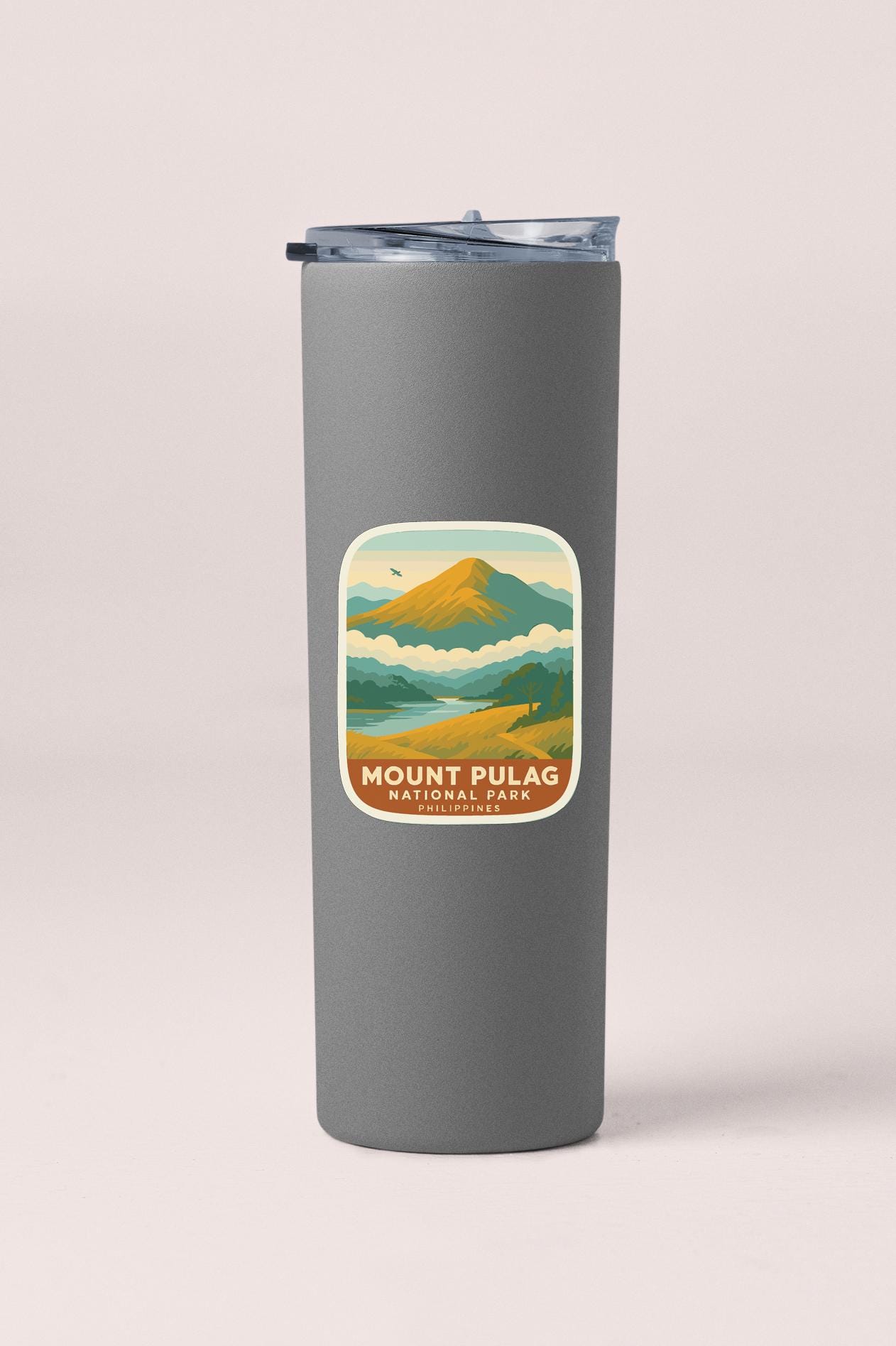 A gray insulated tumbler with a label that says "Mount Pulag National Park Philippines".