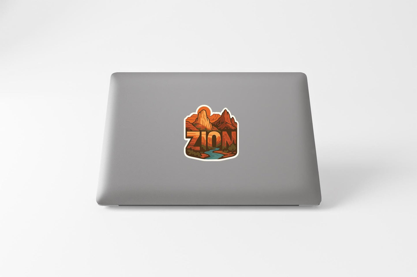 a sticker with the word "ZION" on the back of a laptop.
