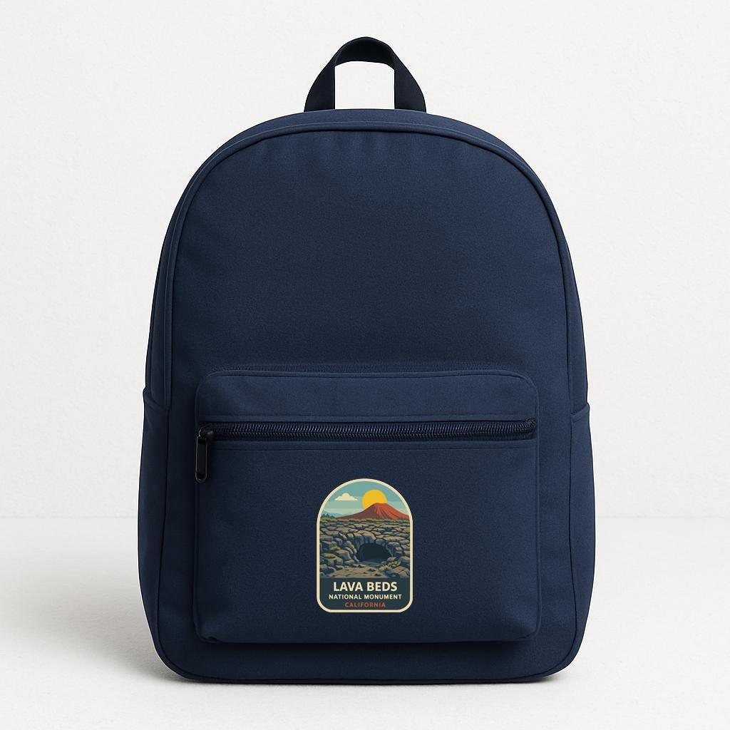 A navy blue backpack with a graphic on the front pocket.