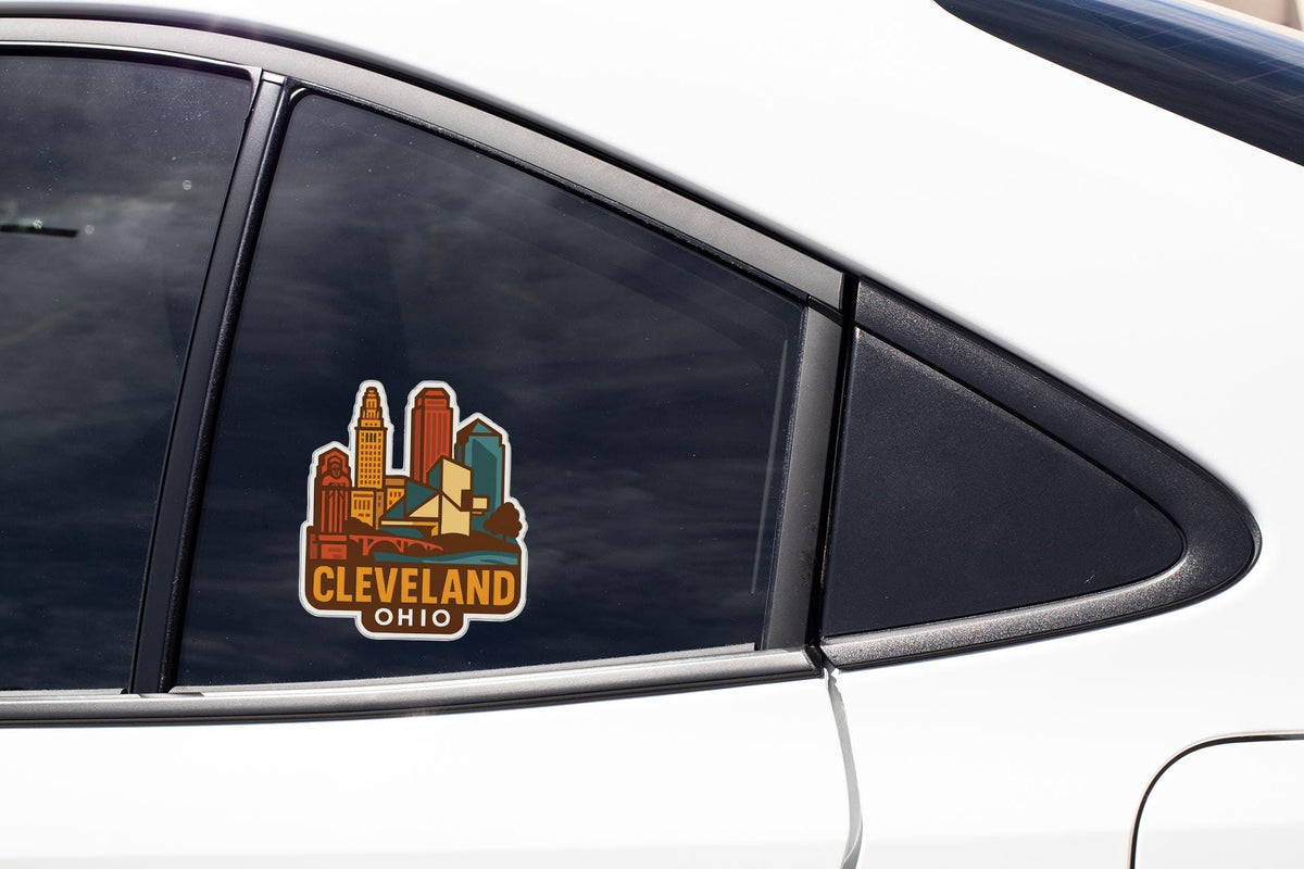A sticker on the side of a car window, depicting the Cleveland, Ohio skyline.