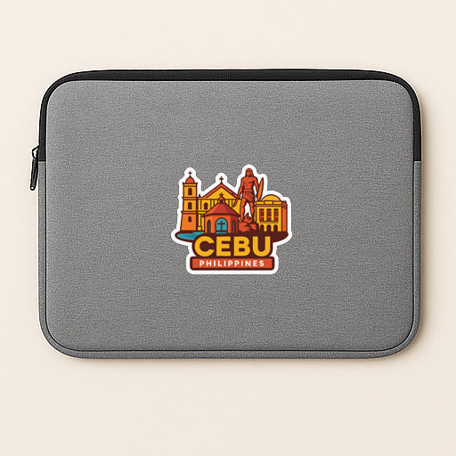 a gray laptop sleeve with a sticker of Cebu, the capital city of the Philippines.