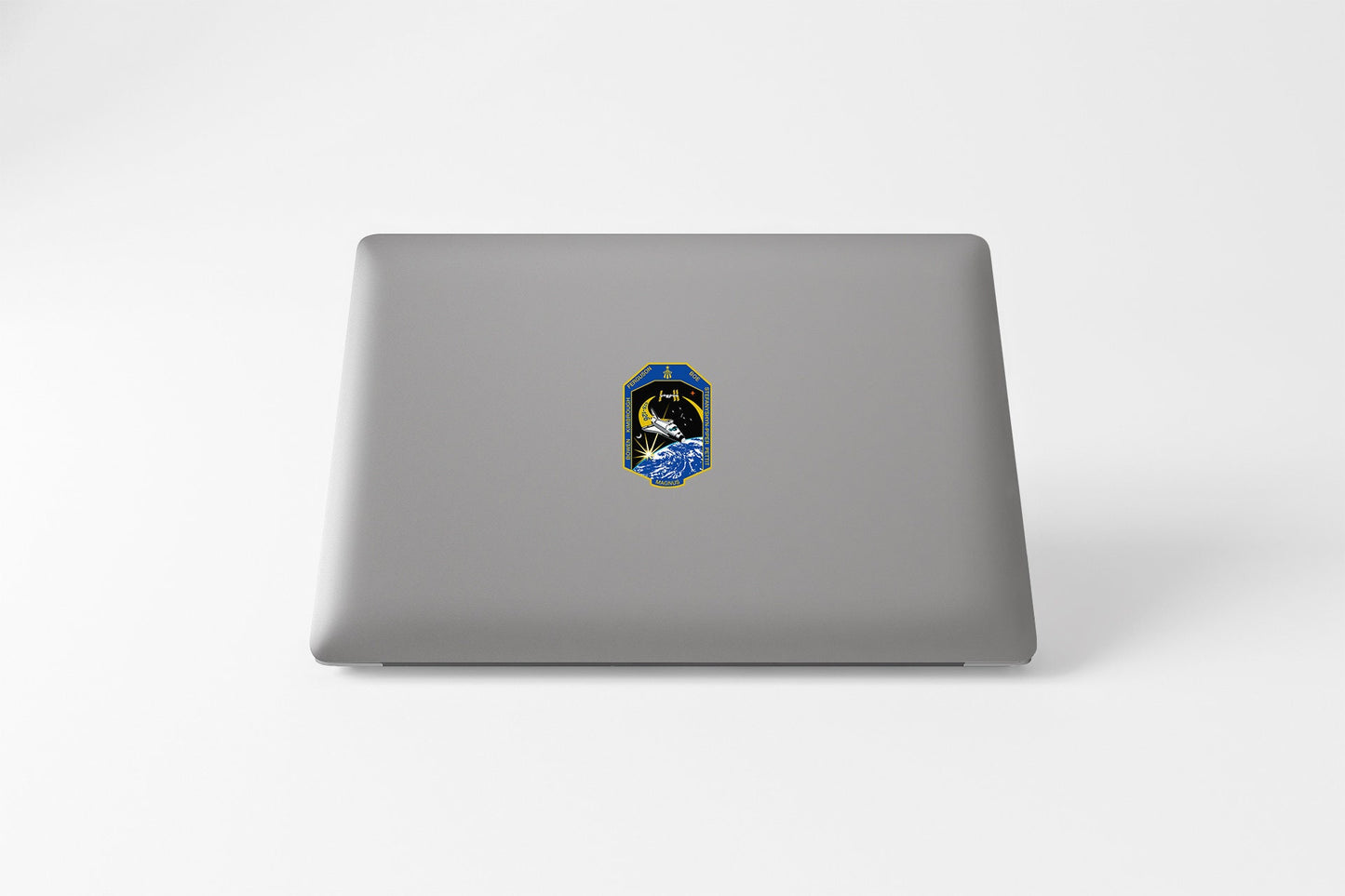 a laptop with a sticker of a person's face
