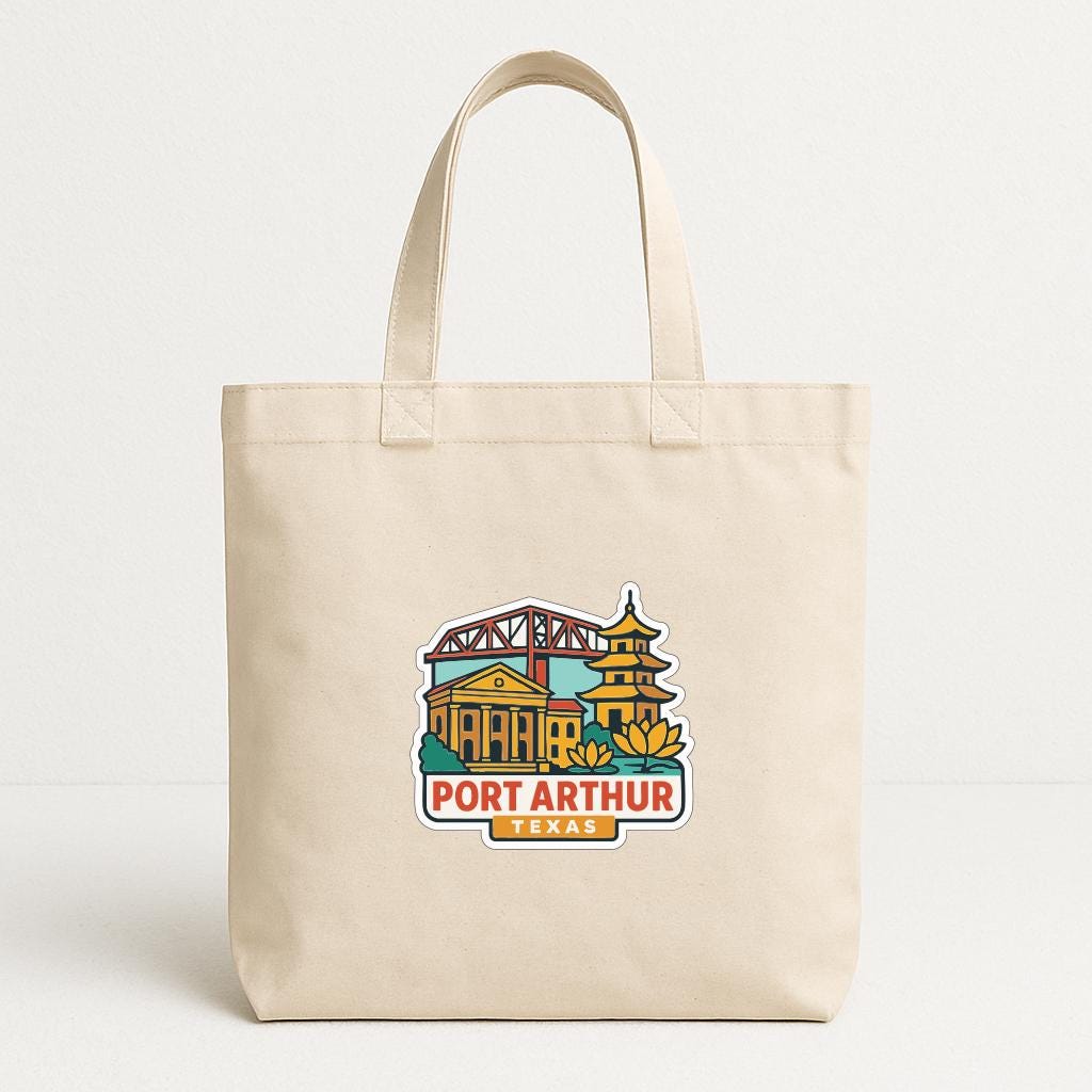 A beige tote bag with a printed design of the Port Arthur, Texas skyline, including a bridge and pagoda.