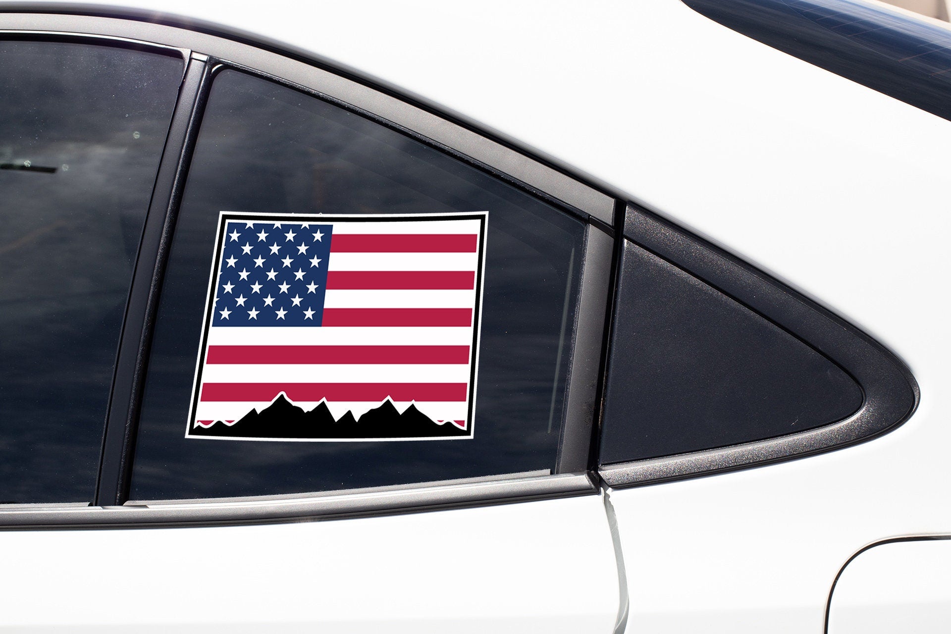 an american flag sticker on the side of a car