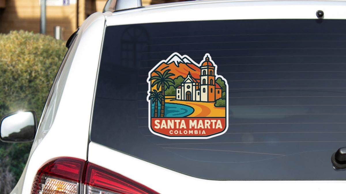 a sticker on the rear window of a car that displays a colorful illustration of Santa Marta, Colombia.
