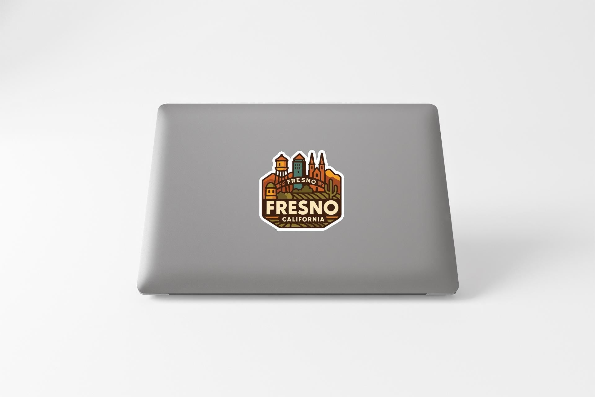 a sticker with the text "FRESNO CALIFORNIA" on the back of a laptop.