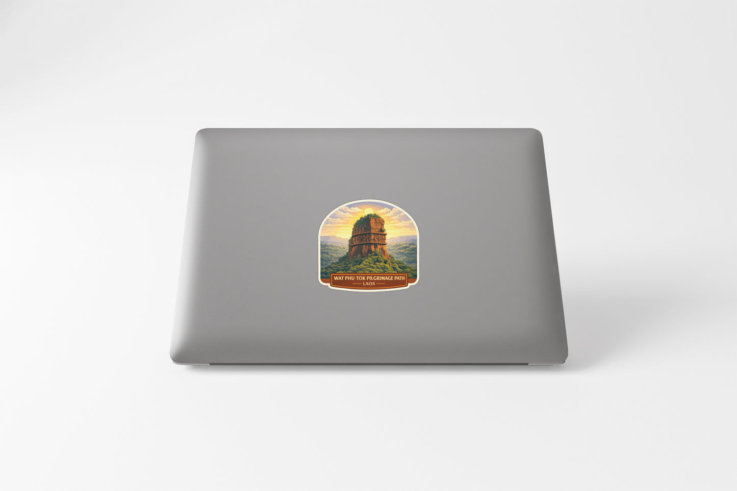 a sticker with a castle or tower on a laptop.