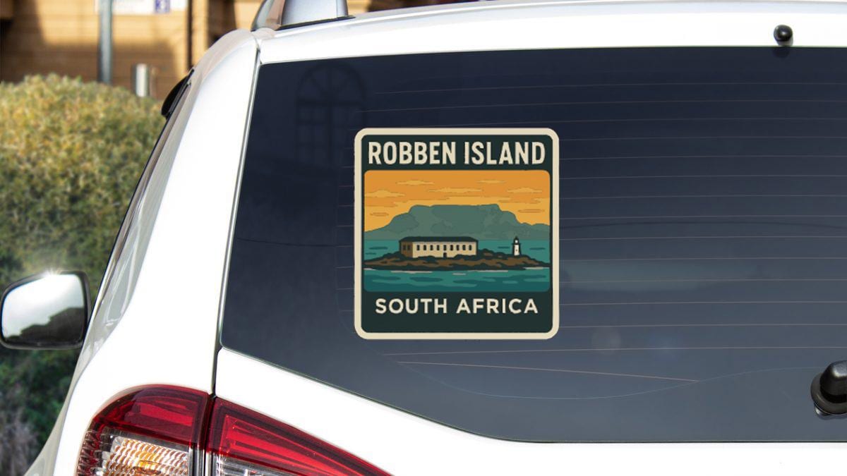 a sticker on the rear window of a car that says "Robben Island South Africa".