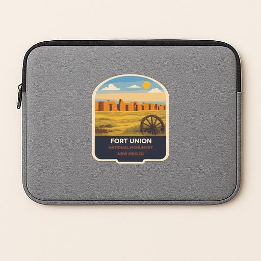 A gray laptop sleeve with a graphic design depicting Fort Union National Monument in Mexico.