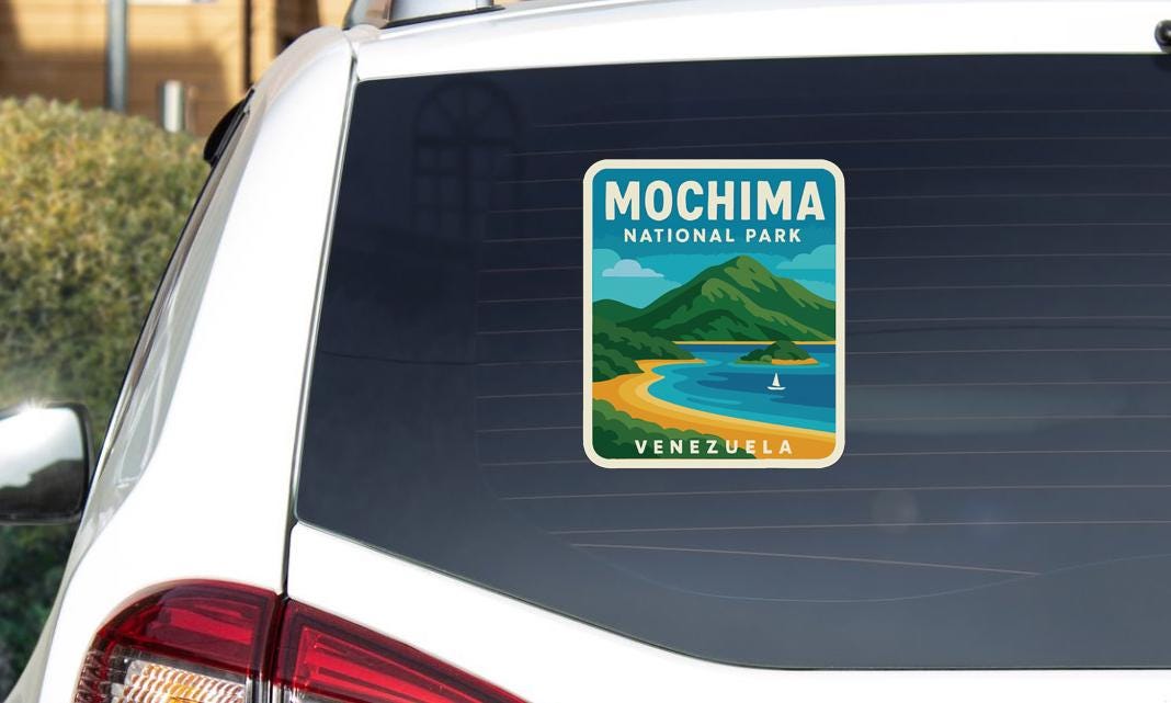 A sticker on the rear window of a car, depicting the landscape of Mochima National Park in Venezuela.