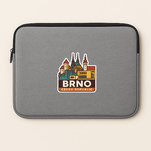 A gray laptop sleeve with a sticker depicting the city of Brno, Czech Republic.