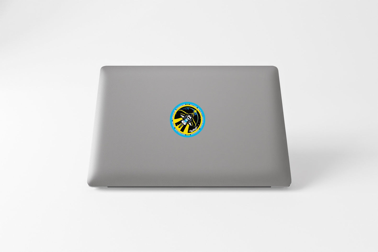 a laptop with a sticker on the cover