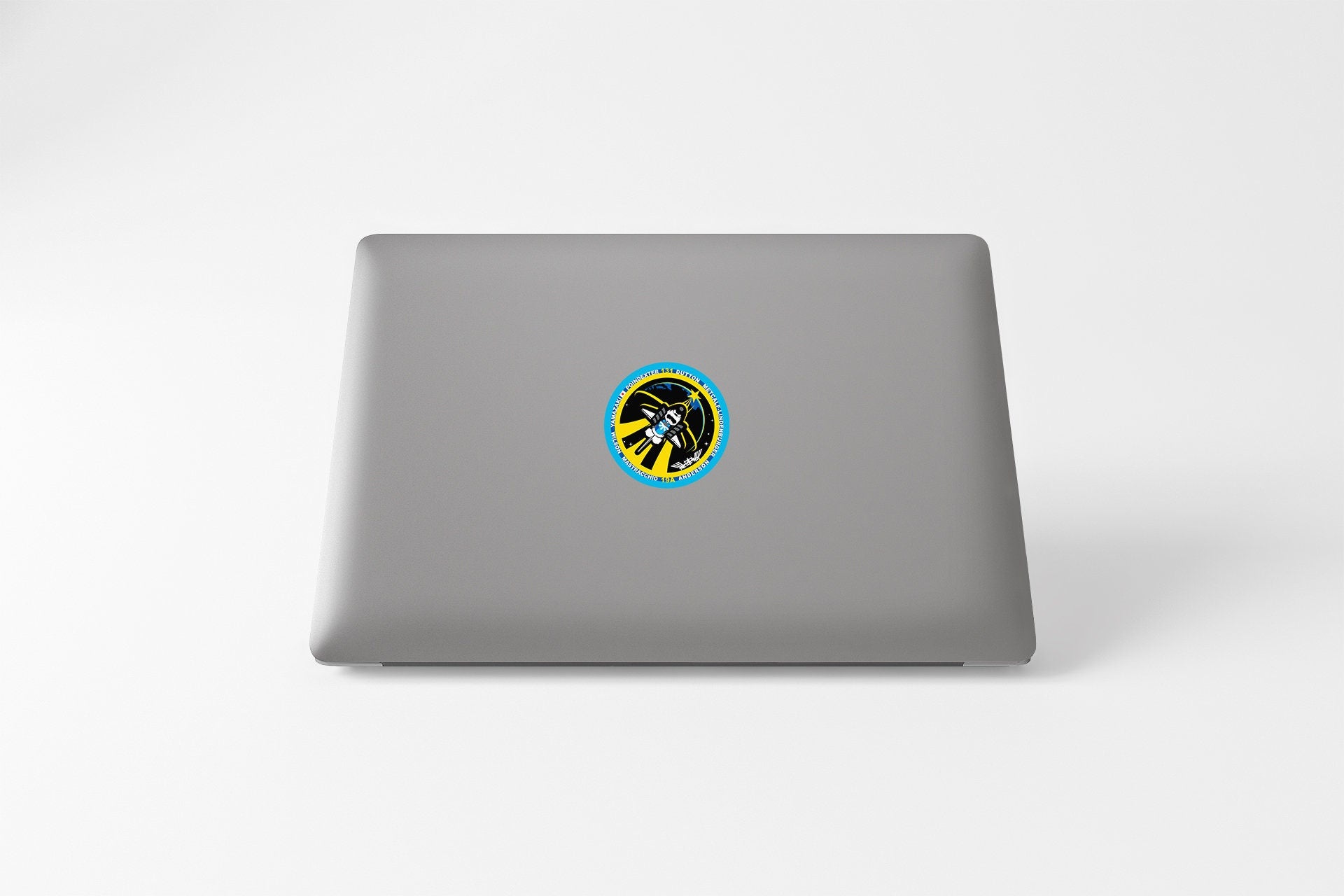 a laptop with a sticker on the cover