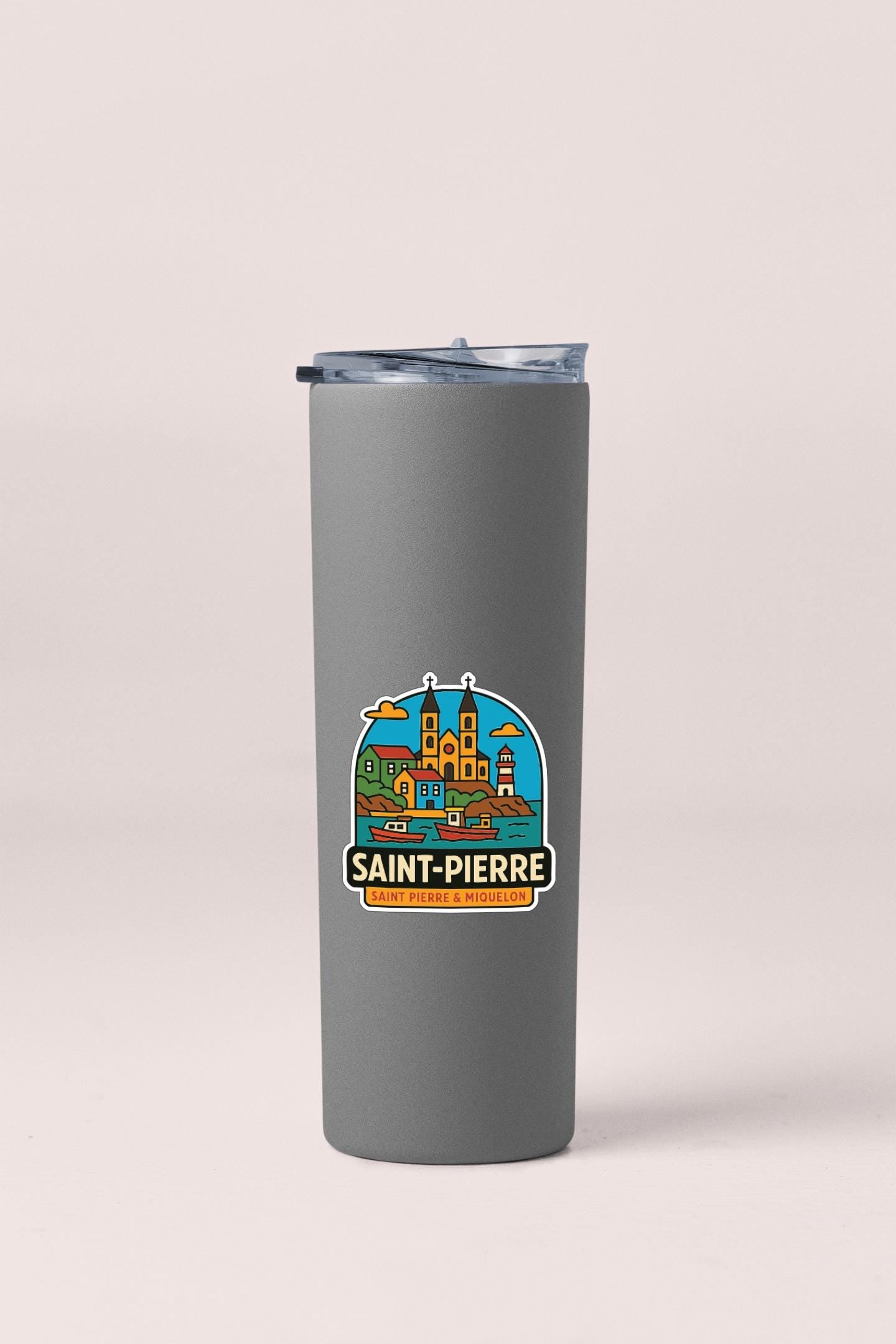 A gray insulated tumbler with a sticker depicting Saint-Pierre, a city in the French Republic.