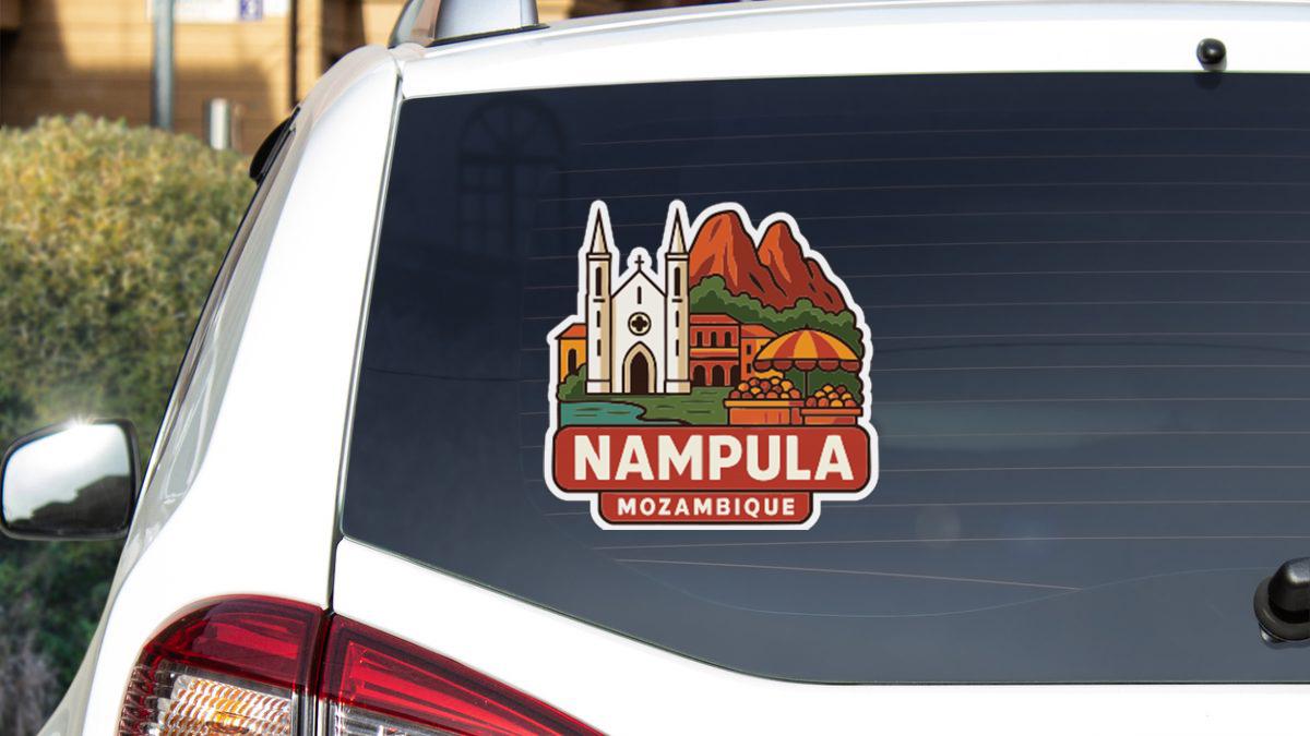 A sticker on the rear window of a car, depicting a scenic view of Nampula, Mozambique.