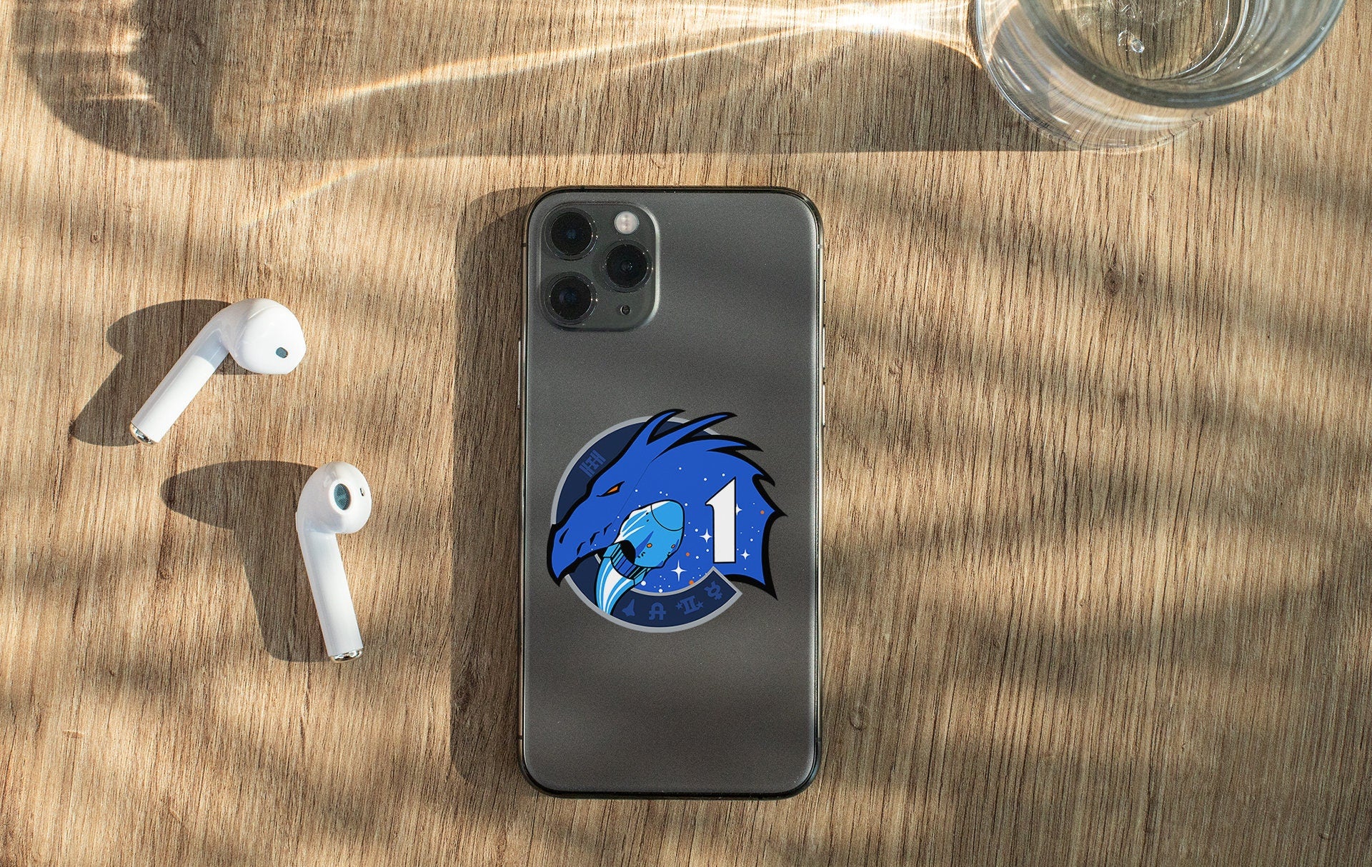 a phone and ear buds on a table