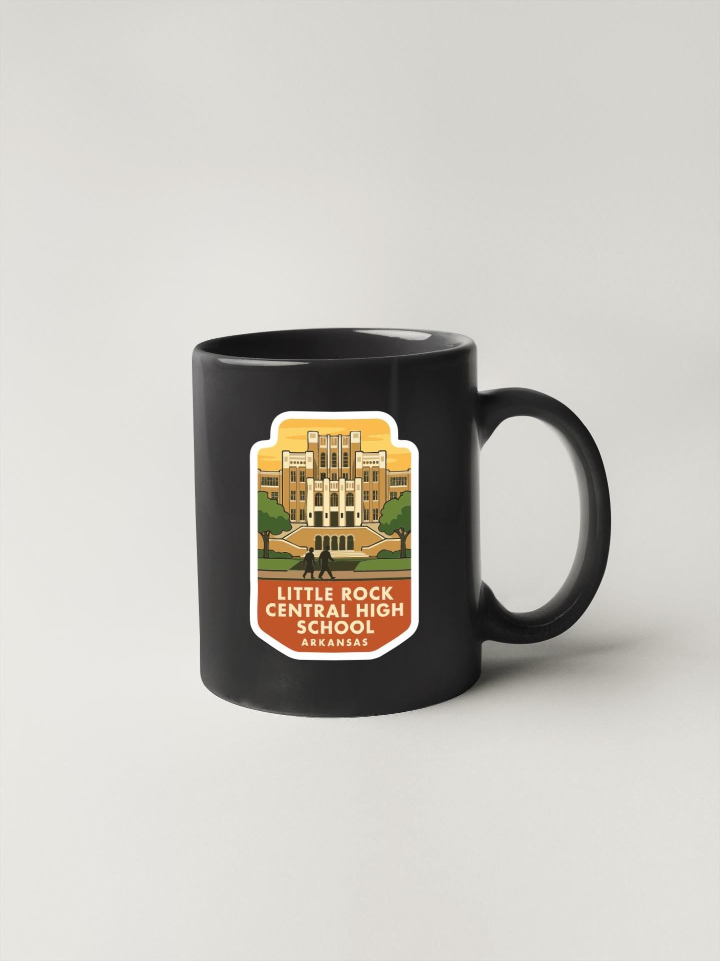 A black coffee mug with a label that says "Little Rock Central High School Arkansas" on it.