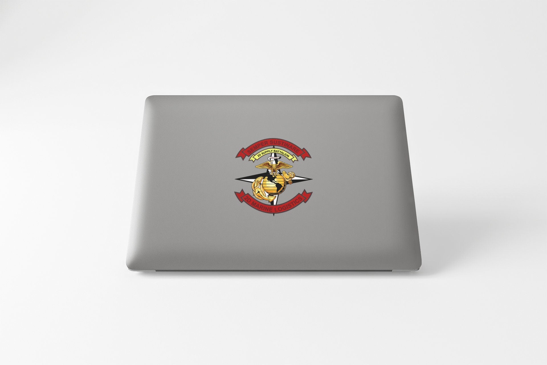 a laptop computer with a sticker of a dog on it