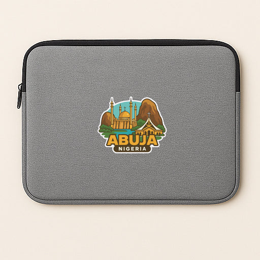 a gray laptop sleeve with a graphic design depicting the city of Abuja, Nigeria.